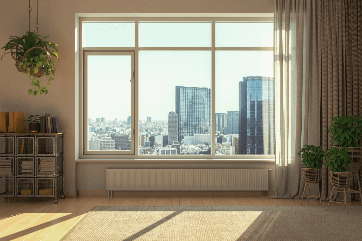 Bright room with cityscape window view.